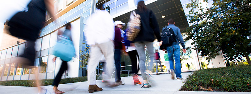 students walking into the medical education technology building on unthsc's campus