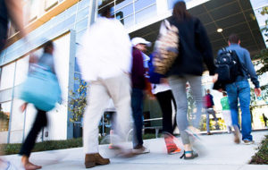 Medical students entering university building