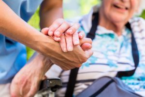 Person Helping an Older Adult, Holding Her Hand