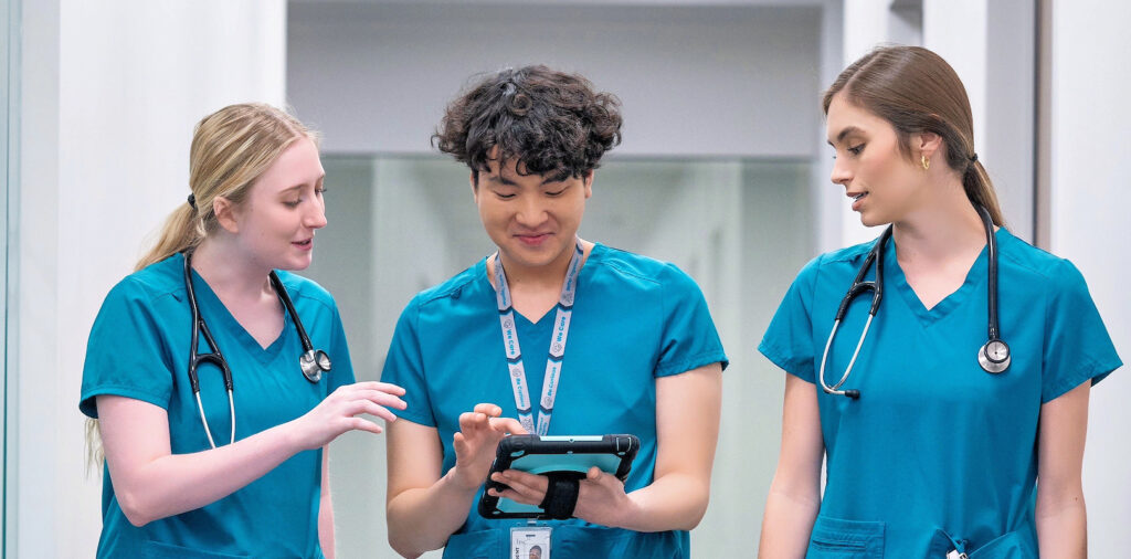 nurses walking through a hospital