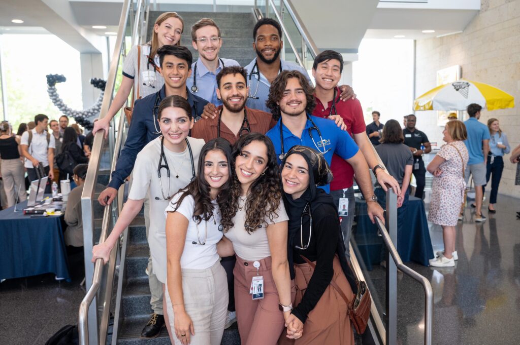 Students standing on staircase