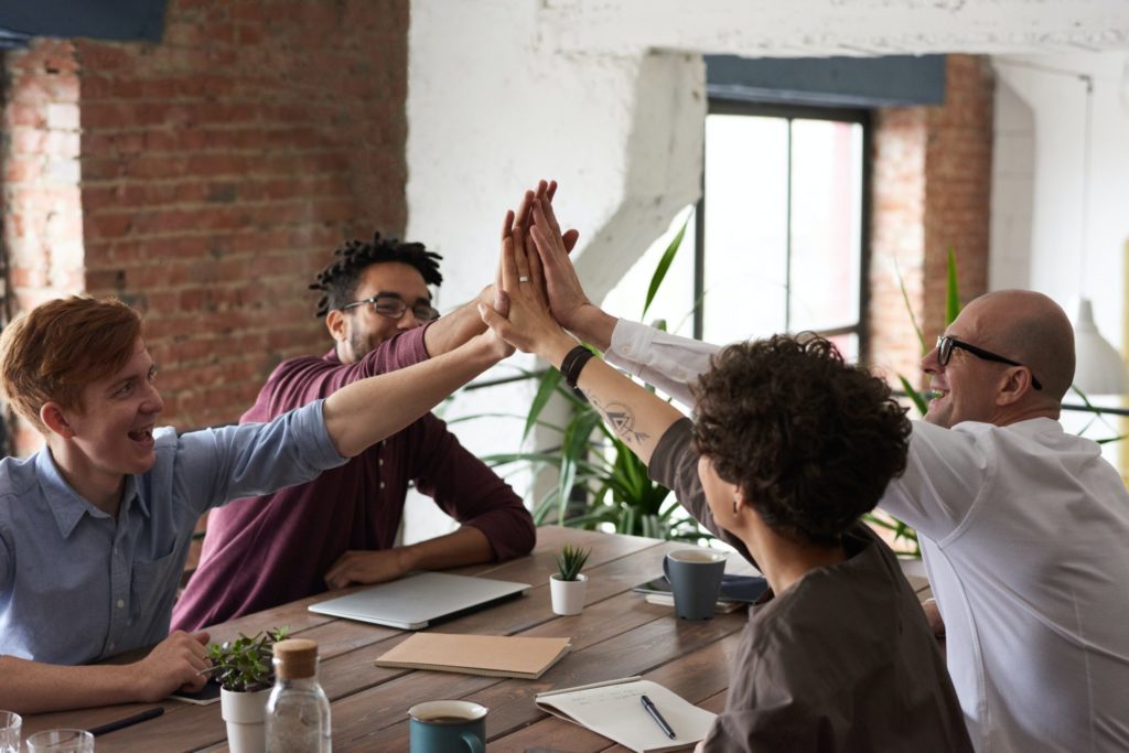 Group giving each other high fives