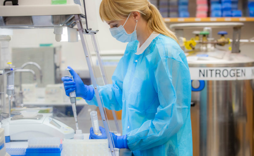 researcher working with bone fragments