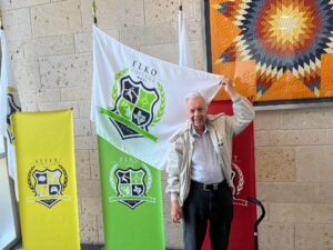 Dr. Elko and the Elko Advisory College Flag