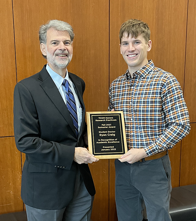 TCOM student Ryan Craig and Dr. John Licciardone