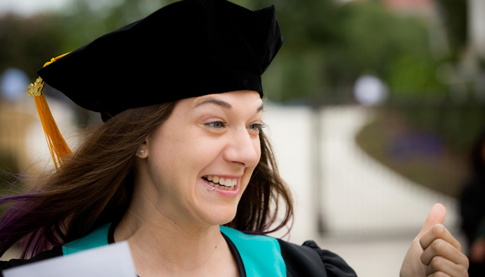 girl smiling at commencement