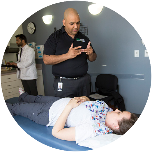 dr. surve speaking with hannah in a patient care room.