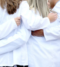 Students in white coats