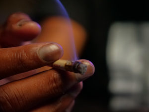 Teen holding marijuana