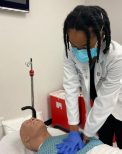 TCOM Students learning how to suture, perform CPR and applying a tournique