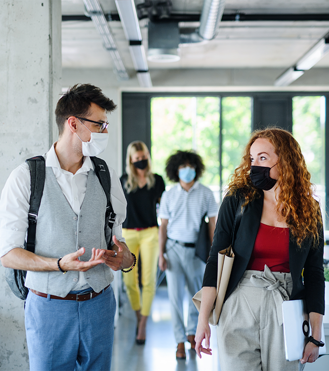 Group of masked students walking together