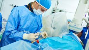 Cardiologist performs surgical procedure