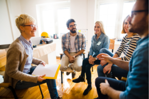 a support group meeting with a therapist